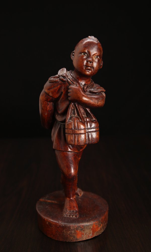 Chinese Carved Cultural Revolution Boy: Carved to depcit a three-dimensional boy figure carrying flasks. 7.125" H. Natural crack in base.