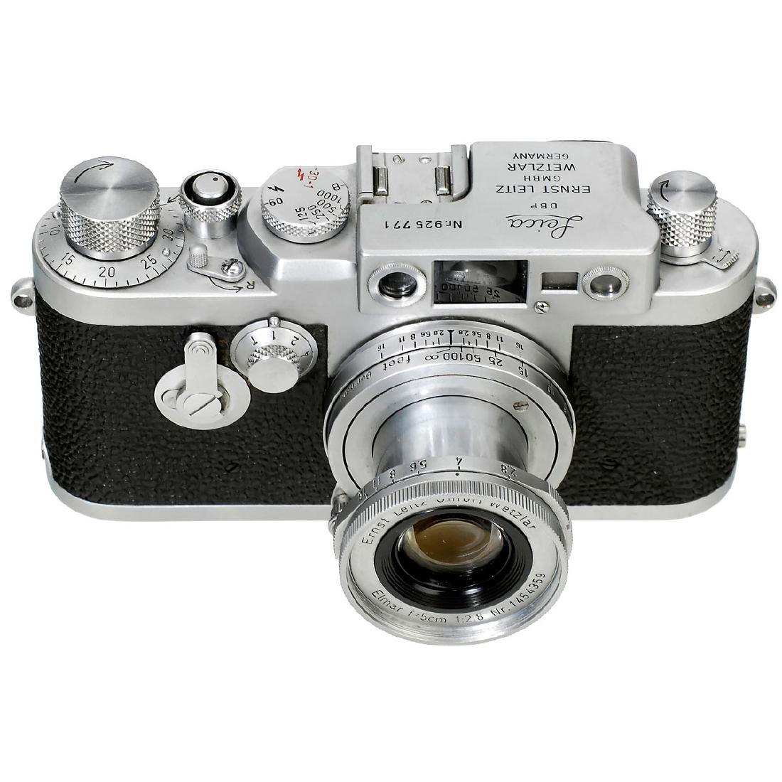 Leica IIIg with Elmar 2,8/5 cm, 1958: Leica IIIg with Elmar 2,8/5 cm, 1958 Leitz, Wetzlar. No. 925771 (converted from Leica Ig), chrome in beautiful condition, vulcanite complete. With Elmar 2,8/5 cm, no. 1454359, feet, lens hood and inst