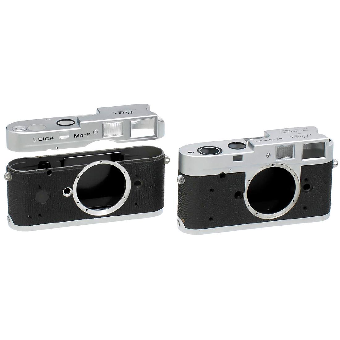 2 Leica Housings: M2 and M4-P: 2 Leica Housings: M2 and M4-P Leitz, Wetzlar. Housing M2 with engravings and serial numbers (M2–M975400) and housing with engraving "Leica M4-P". 2 Gehäuse-Schalen: M2 und M4-P Leitz, Wetzlar. G