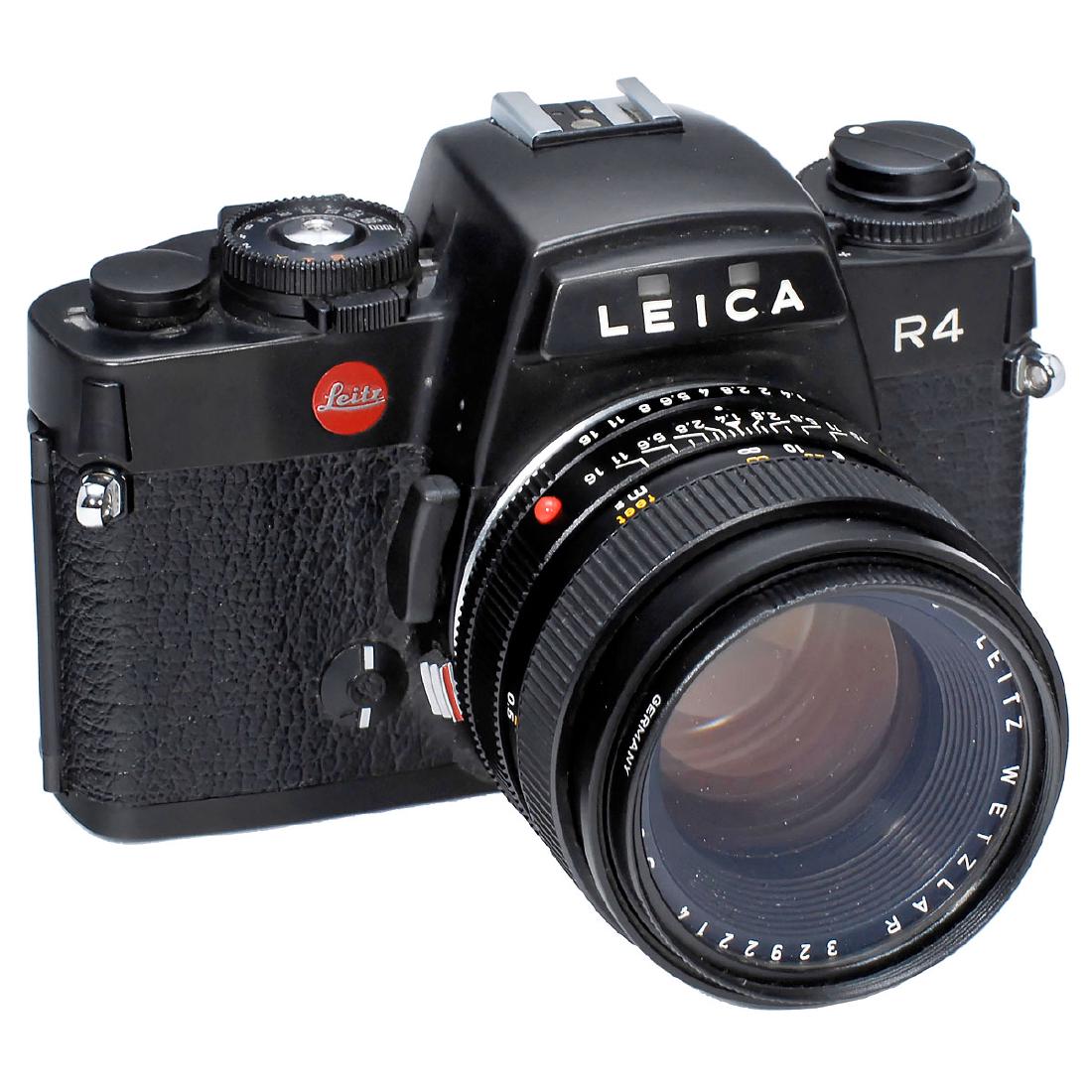 Leica R4 with Summilux-R 1,4/50 mm: Leica R4 with Summilux-R 1,4/50 mm Leitz, Wetzlar. Leica R4, no. 1669582, electronic functions working, with carrying strap. Summilux-R 1,4/50 mm, no. 3292214, "Leitz Wetzlar", excellent condition, ne