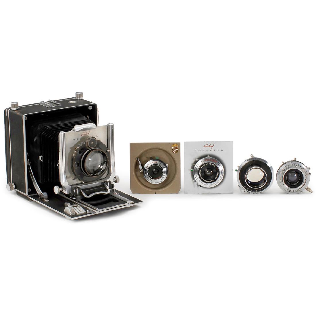 Linhof Technika 9 x 12 cm Outfit: Linhof Technika 9 x 12 cm Outfit Linhof, Munich. Technika folding-bed camera, size 9 x 12 cm, no. 6158. With 5 lenses: a) Angulon 6,8/65 mm in Synchro-Compur. – b) Angulon 6,8/90 mm in Synchro-Compu