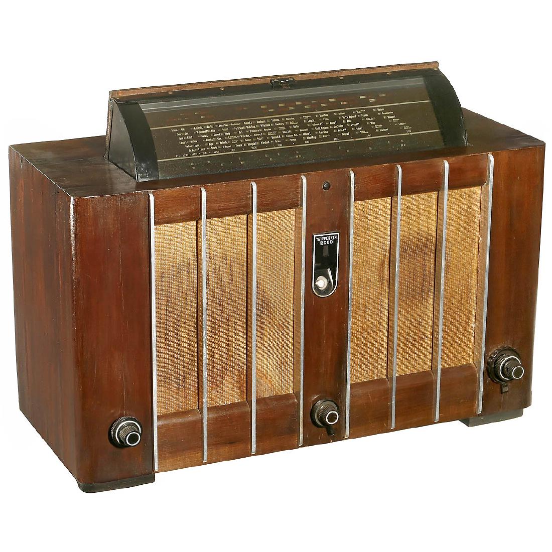 Telefunken-Spitzen-Super 8000 GWK Radio, 1938: Telefunken-Spitzen-Super 8000 GWK Radio, 1938 Telefunken, Germany. 11 valves, LW, MW and SW, 2 loudspeakers, wood case with folding scale, good condition, complete. Design award winner at the World Ex