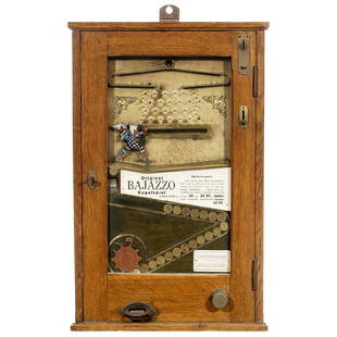 Bajazzo German Skill Game, c. 1935: "Bajazzo" German Skill Game, c. 1935 By Paul Schülke, Berlin. Mod. B, slot for 10 pfennig, visible coin chute, oak case, brass fittings, all parts original including clown and instruction cards, no