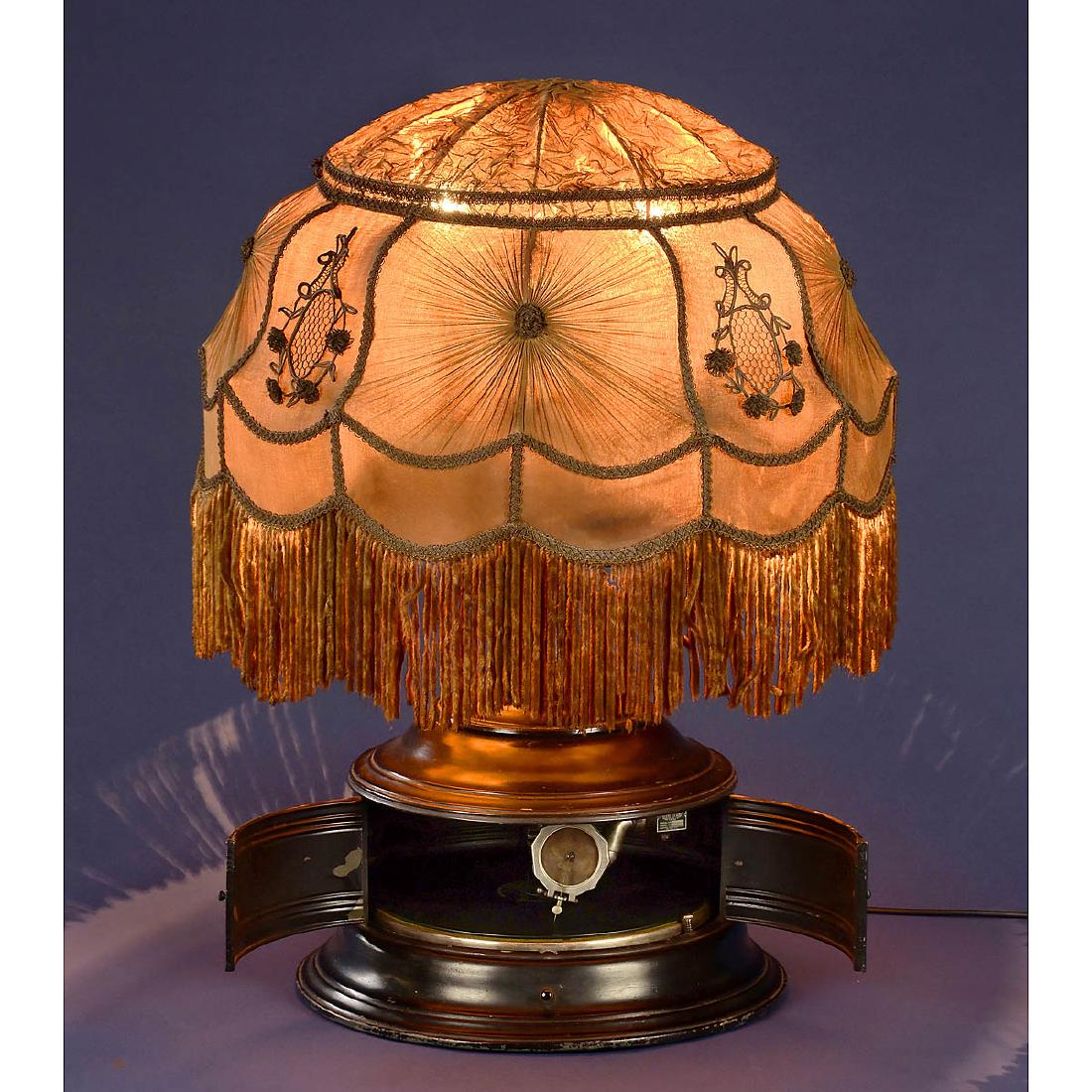 Phonolamp Model A, c. 1920: Phonolamp Model A, c. 1920 No. 1015, by Electric Phonograph Corp., New York. Supreme reproducer, electric motor drive (230 V), metal case, height 32 1/3 in., original embroidered lampshade, working,