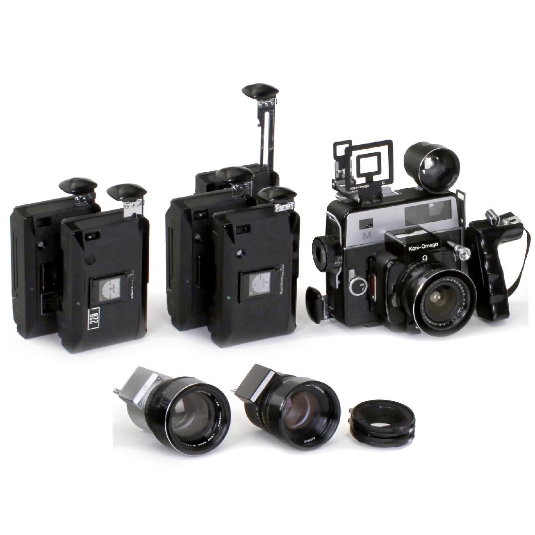 Koni-Omega Rapid "M" Outfit, c. 1967: Koni-Omega Rapid "M" Outfit, c. 1967 Konishiroku Photo, Japan. Professional 6 x 7 cm (55 x 68 mm) rollfilm camera. 3 lenses: Hexanon 5,6/60 mm, Hexanon 3,5/135 mm and Hexanon 4,5/180 mm. 3 magazines t