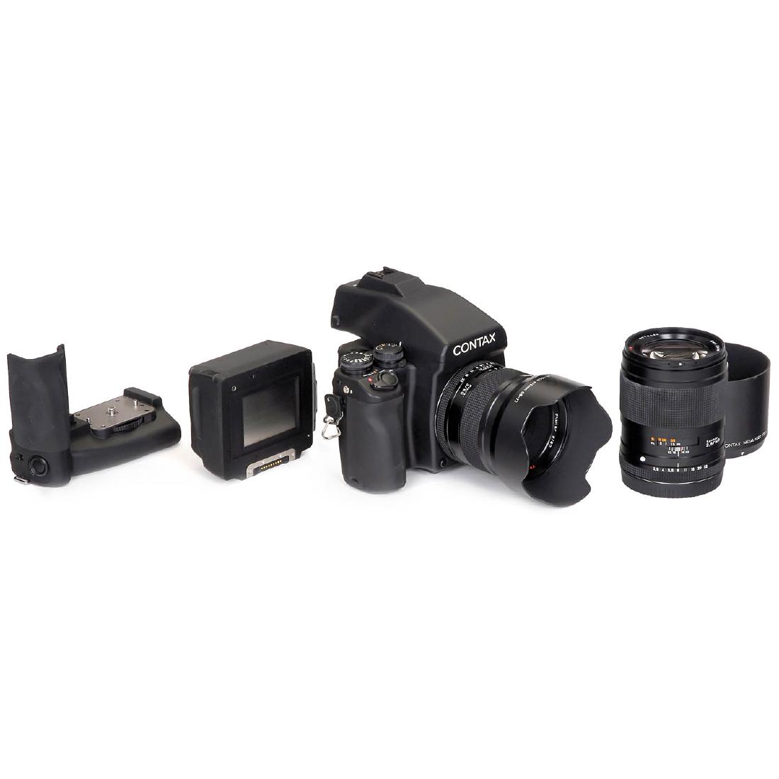 Contax 645 with 2 Lenses: Contax 645 with 2 Lenses Kyocera, Japan. 1) Contax 645 body with magazine and Contax MF-1 prism finder. Contax Battery Holder MP-1. - 2) Carl Zeiss Planar 2/80 mm, no. 8770354, with lens hood. - 3) Ca