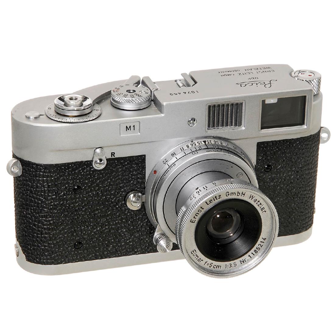 Leica M1 with Elmar 3,5/5 cm, 1963: Leica M1 with Elmar 3,5/5 cm, 1963 Leitz, Wetzlar. No. 1074459, version with lever rewind, vulcanite top. With Elmar 3,5/5 cm, no. 1185214. - Excellent condition! Leica M1 mit Elmar 3,5/5 cm, 1963 Lei