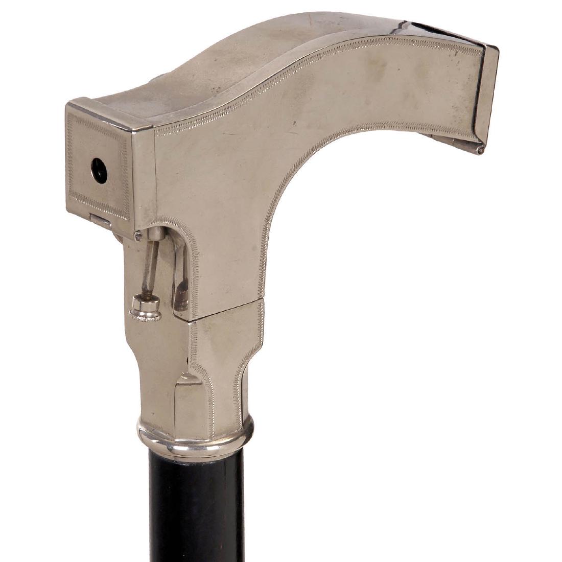 Ben Akiba Cane Handle Camera: Ben Akiba Cane Handle Camera Replica. Picture size 16 x 20 mm on rollfilm, storage space in handle for more rollfilms, camera body of nickel-plated silver, inside with 5 spools, shutter on time not wo