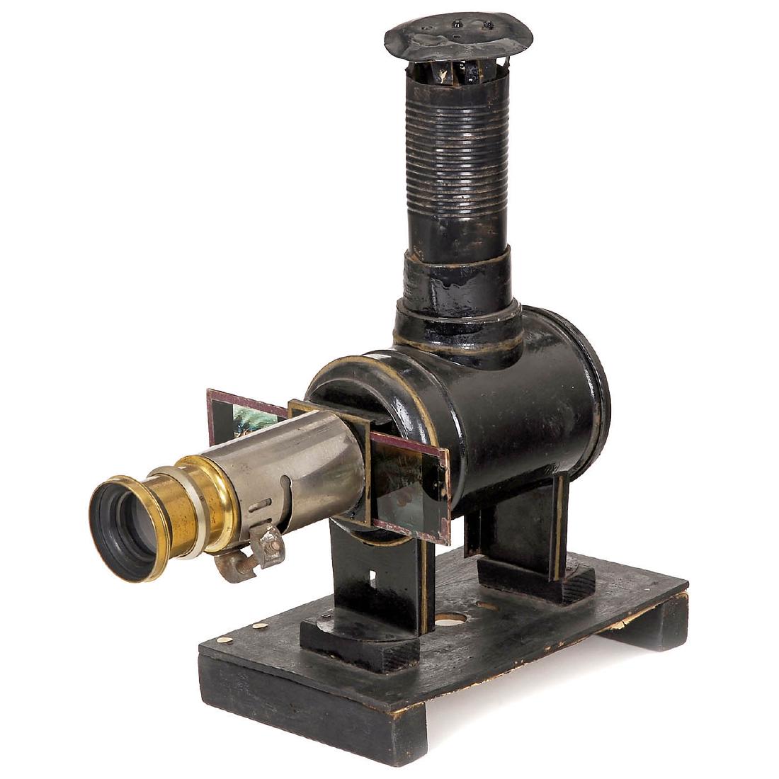 Tinplate Magic Lantern, c. 1890: Tinplate Magic Lantern, c. 1890 Unmarked, presumably Ernst Plank. Black-lacquered body, for glass slides with height of 2 in., chimney and lens replaced, lantern on wooden base. Schwarze Laterna Magic