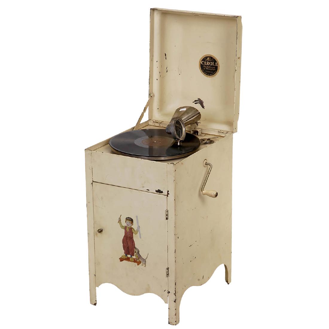 Carola Miniature Floor Gramophone, c. 1925: Carola Miniature Floor Gramophone, c. 1925 USA, toy phonograph, "The Nightingale of Phonographs", metal cabinet with decals, plug-in horn, height 22 ½ in., working. Miniatur-Standgrammophon "Carol