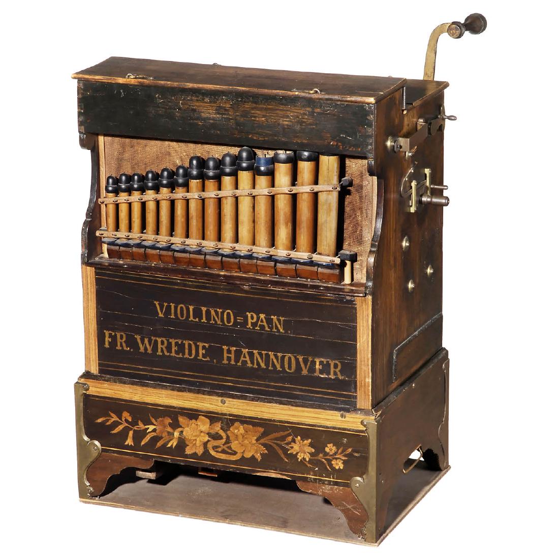 Fritz Wrede Violino-Pan Street Barrel Organ, c. 1920: Fritz Wrede Violino-Pan Street Barrel Organ, c. 1920 Hanover, Germany. For left-handers, 26 notes, 1 stop, visible pan flutes, bottom pipes, 8 tunes, original tune-sheet, wood case with inlay on the 