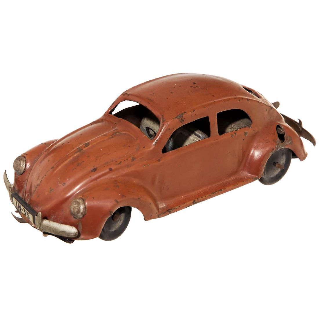 KdF Beetle by Johann Neuhierl, c. 1938: KdF Beetle by Johann Neuhierl, c. 1938 JNF - Johann Neuhierl, Fürth, Germany. VW "Pretzel" Beetle, license number IN-35, tin, spring-driven (working), steerable front wheels, length 6 9/10 in., very 