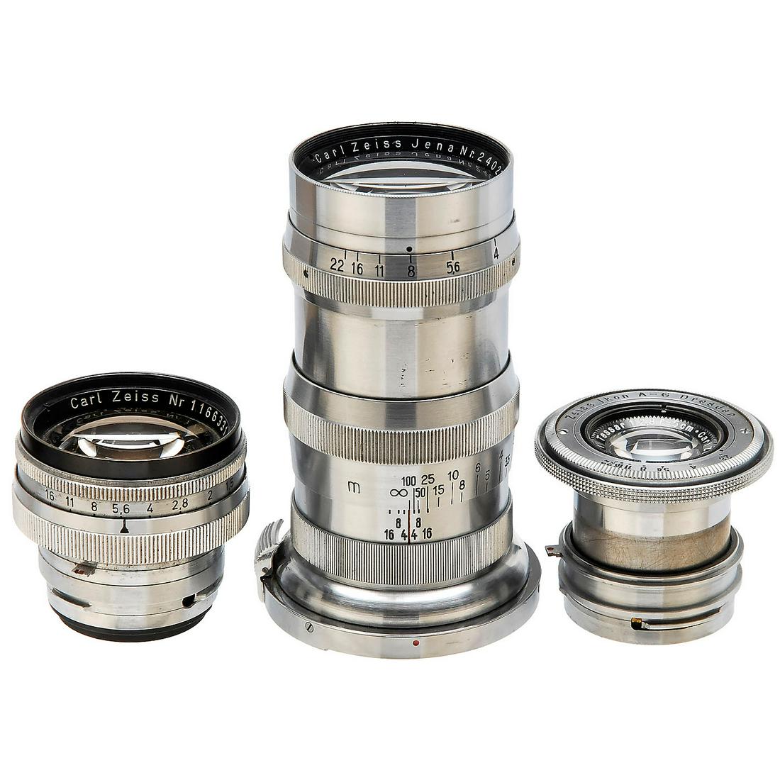3 Contax Lenses: 3 Contax Lenses Carl Zeiss Jena/Zeiss Ikon, Dresden. Pre-war lenses. 1) Sonnar 1,5/50 mm, no. 1166331, black front ring. - 2) Tessar 2,8/5 cm, no. 1912511, chrome. - And: 3) Sonnar 4/13,5 cm, no. 2402