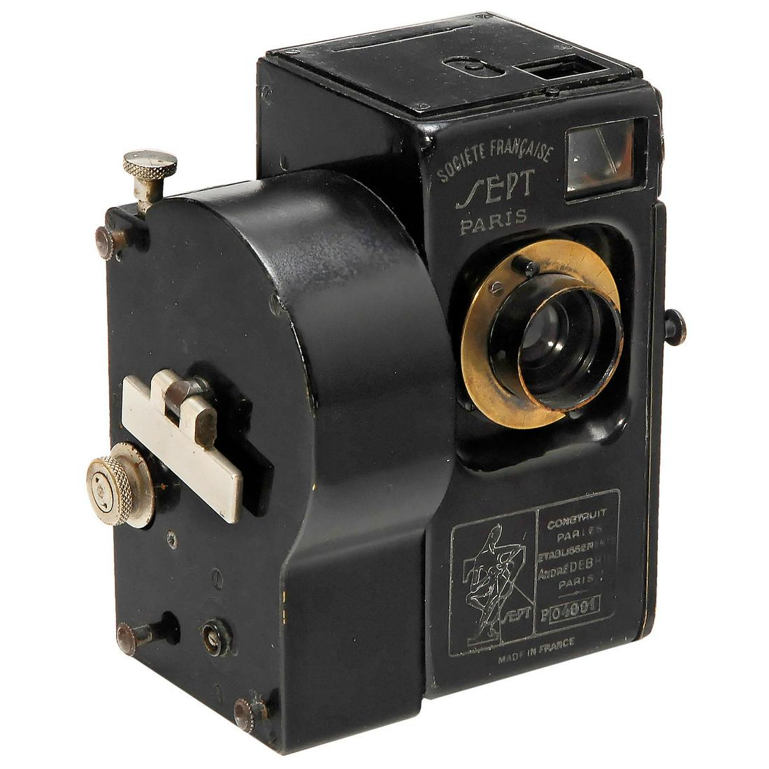 Debrie Sept, 1923: Debrie Sept, 1923 Debrie (Ets. André Debrie, Paris). Spring-motor camera for still, rapid sequence, or cine use, 18 x 24 mm format on 5m cartridge of 35mm film, with Optis Anastigmat 3,5/50 mm. The D