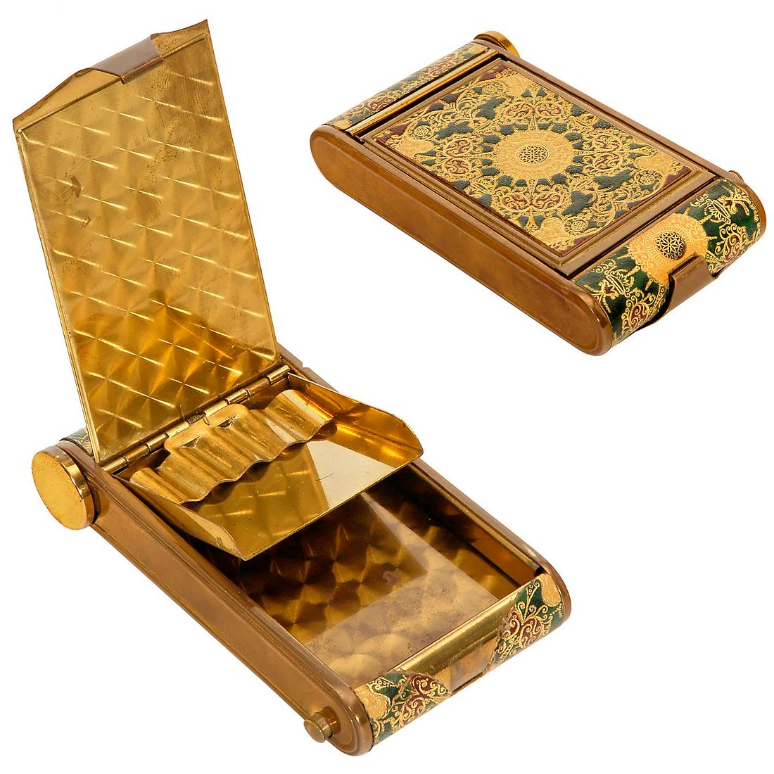Camera-Form Vanity Set with Patterned Covering: Camera-Form Vanity Set with Patterned Covering Cigarette case in form of a Kodak Vest-Pocket camera. Brass body with attractive patterned decoration, one side for cigarettes, the other side a powder c