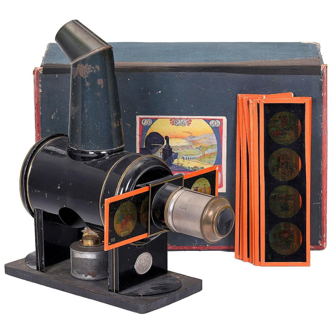 Magic Lantern by Plank, c. 1880-90: Magic Lantern by Plank, c. 1880-90 Ernst Plank, Nuremberg. Barrel-shaped, black-lacquered with ornamental gilt rings, for slides with height of 2 1/3 in., original lens and original chimney, with burn