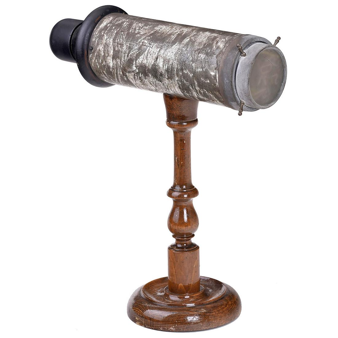 Brewster-Type Kaleidoscope, c. 1870: Brewster-Type Kaleidoscope, c. 1870 Unmarked. Metal tube (hammered finish), aluminum front, on turned wood stand (10 in.), 2 internal mirrors, with small colored glass pieces, total height 11 ¾ in. -