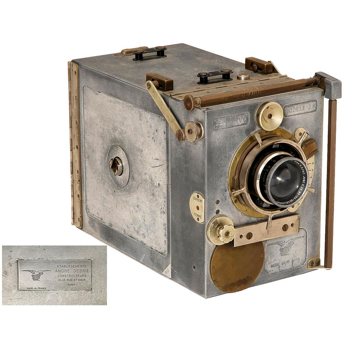 Le Parvo Modèle JK, c. 1922: Le Parvo Modèle JK, c. 1922 André Debrie, Paris. Body no. 3000. 35mm movie camera 120m film cassettes, lens: Astro Pan Tachar 1:1,8/75 mm, crank-drive and adjustable sector wheel. This camera has be