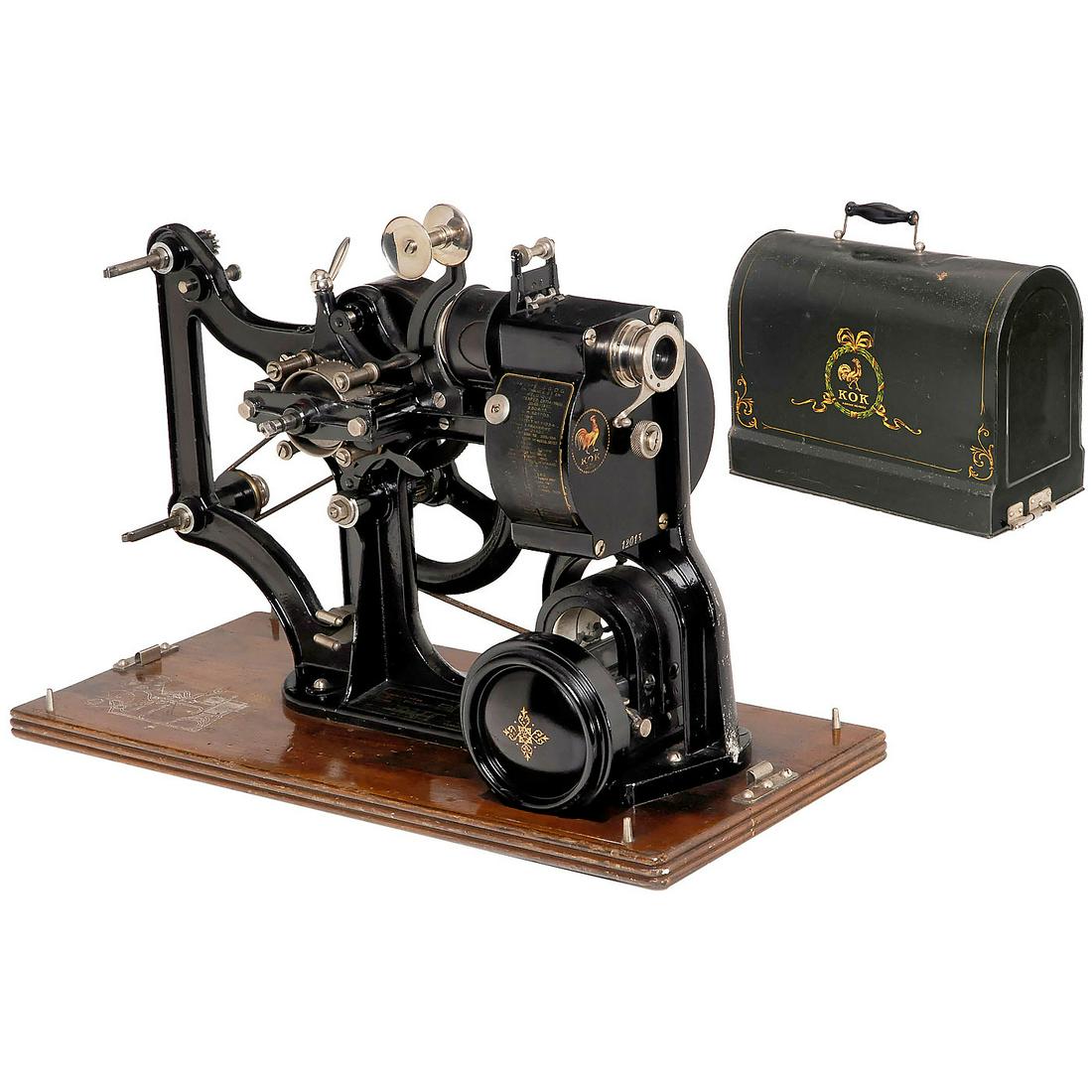 Pathé Kok Cinematograph, c. 1912: Pathé Kok Cinematograph, c. 1912 Pathé, Paris. Movie projector for 28 mm wide film, low-voltage lamp, crank-drive (crank missing), dynamo. - In addition: 2 spools of approx. 70 m of 28mm film and me