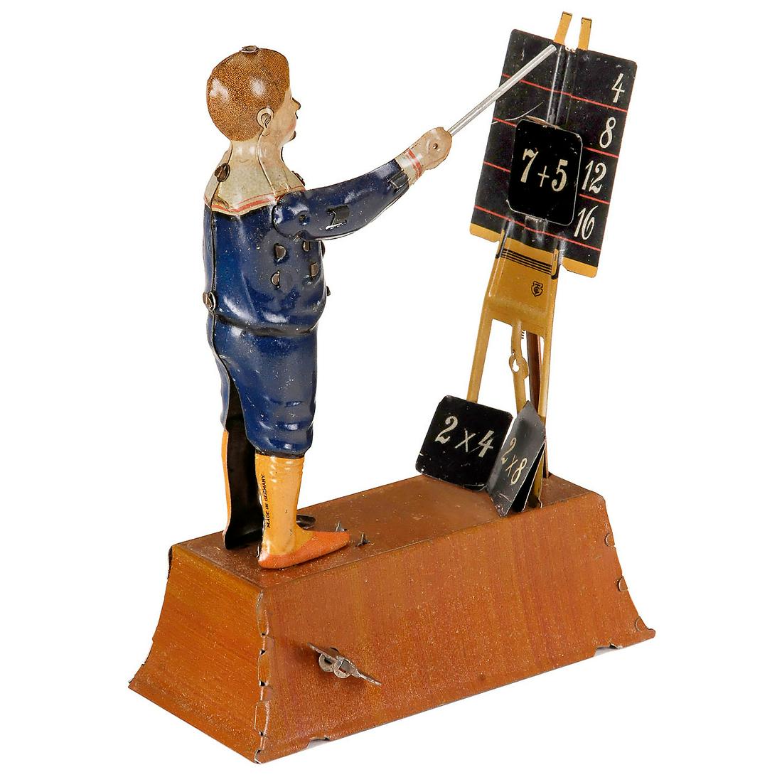 Calculating Boy, c. 1913: Calculating Boy, c. 1913 Extremely rare clockwork tin toy by Tipp & Co., Nuremberg, Germany. After winding, place the example to be calculated between 2 clamps on the black board and the little calcul