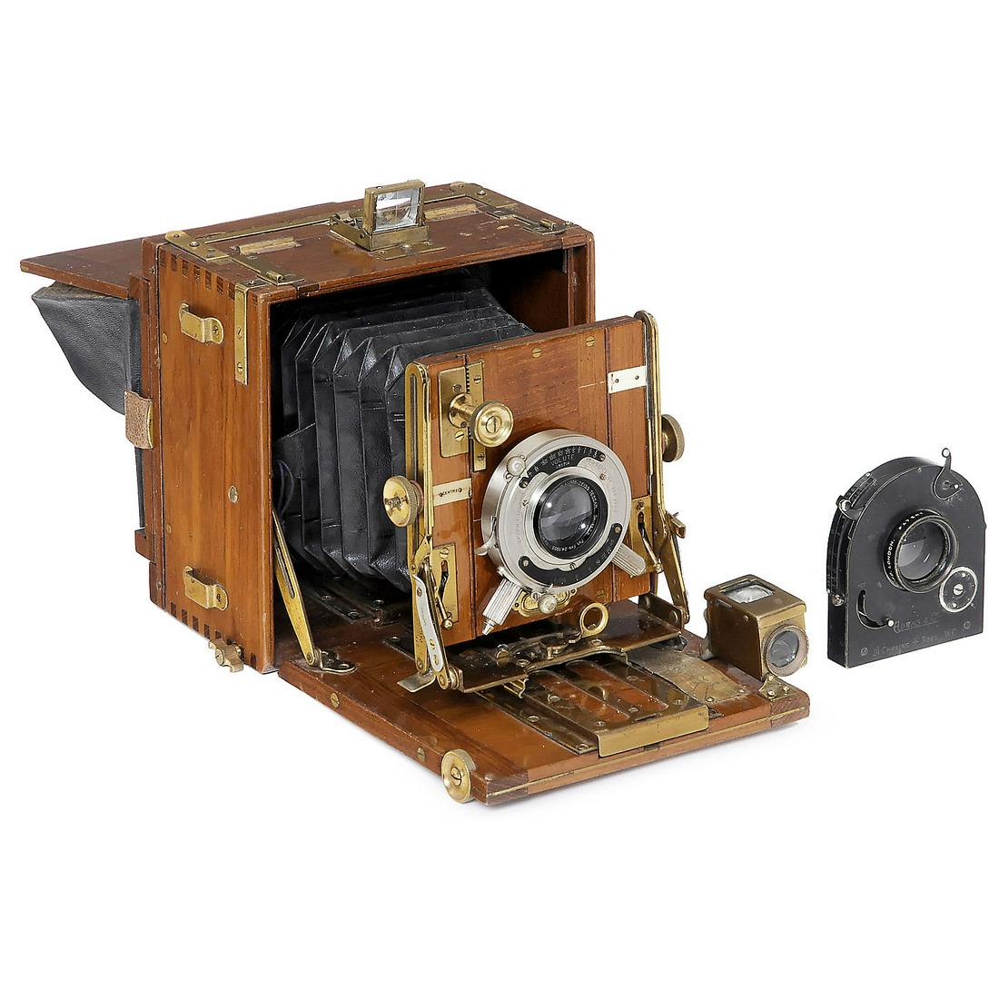 The Sanderson Tropical Hand-and-Stand Camera, c. 1920: The Sanderson Tropical Hand-and-Stand Camera, c. 1920 Sanderson, England. Plate size 4 x 5 in., polished teak with brass fittings, Bausch & Lomb Zeiss Tessar 6,3/4 x 5 in Volute shutter (working), bl