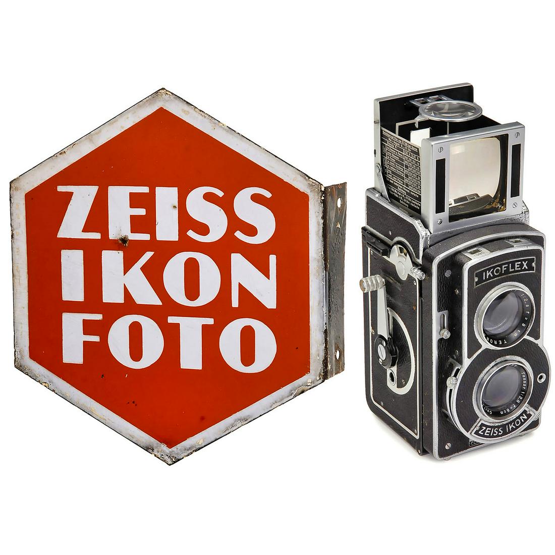 Zeiss Ikon Enamel Sign and Ikoflex III, c. 1939: Zeiss Ikon Enamel Sign and Ikoflex III, c. 1939 1) Double-sided Zeiss Ikon enamel sign, one side "ZEISS IKON FOTO", the other "ZEISS IKON FILM", 29 x 33 cm, with mounting side. (3-/-) - And: 2) Ikofle