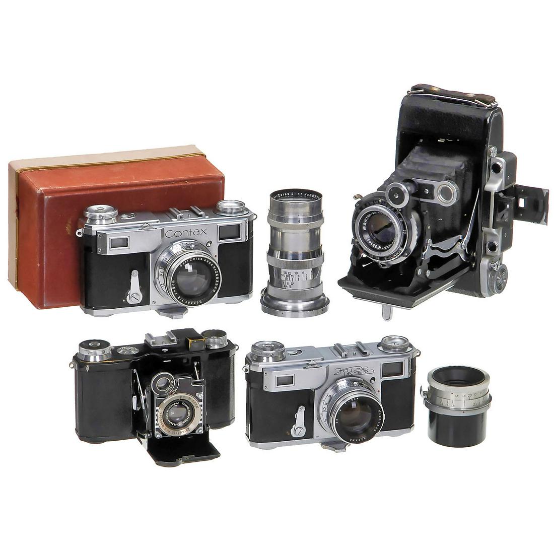 Contax II, Super Nettel, Kiev II and Moskau-2: Contax II, Super Nettel, Kiev II and Moskau-2 1) Zeiss Ikon, Dresden. Contax II no. M39935, shutter over 1/10 sticking, with Sonnar 2/5 cm. (3+/3) - With white and red maker´s box, case and instructi