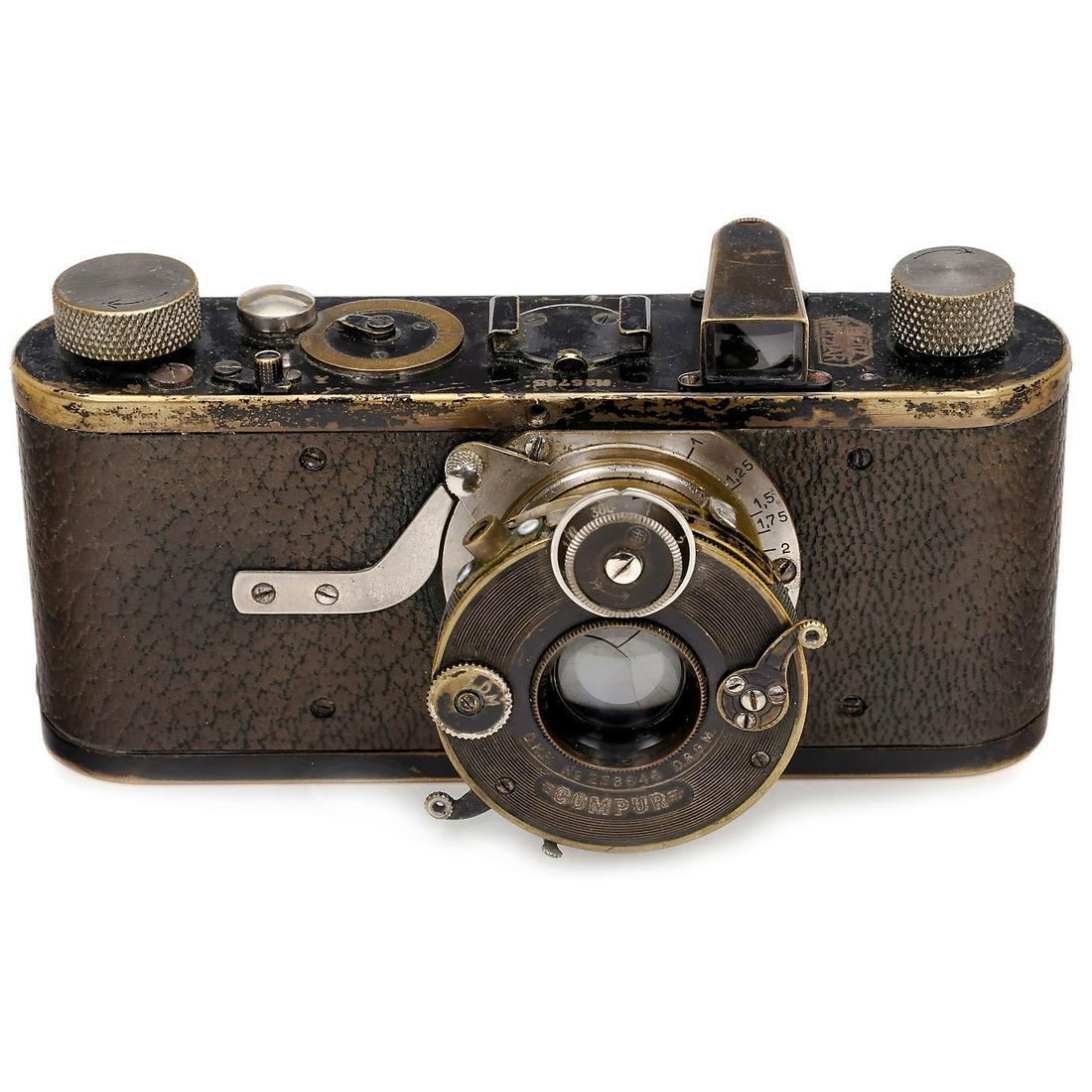 Compur Leica (Model B), 1927: Compur Leica (Model B), 1927 Leitz, Wetzlar. No. 5785, with unnumbered Elmar 3,5/50 mm lens in dial-set Compur shutter 1-1/300 sec., B, T, no. 953200, one screw replaced and cable release plug replace
