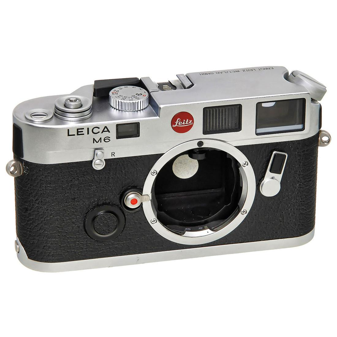 Leica M6, c. 1987: Leica M6, c. 1987 Leitz, Wetzlar. No. 1713331, early model, with red Leitz logo and "ERNST LEITZ WETZLAR GMBH" engraved on top plate, with body cap. Leica M6, um 1987 Leitz, Wetzlar. Nr. 1713331, frü