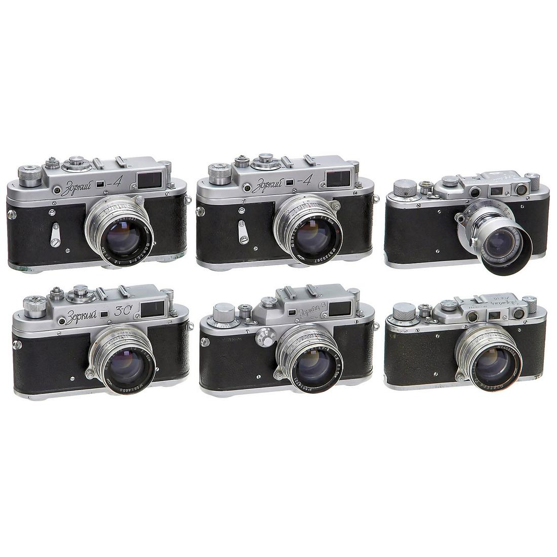 6 Zorki Leica Copies: 6 Zorki Leica Copies Krasnogorsk, USSR. 1) Zorki 1 no. 20828 with Industar 3,5/50 mm, with original Leitz filter and original Summaron-Elmar 3,5 cm sunshade. - 2) Zorki 1c no. 126111, Cyrillic and Lat