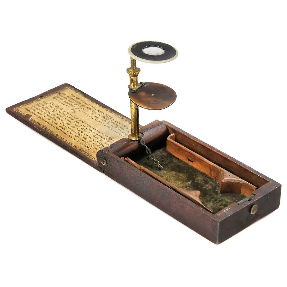 The Botanic Microscope by William Withering, c. 1795: The Botanic Microscope by William Withering, c. 1795 William Withering (1741-1799), British botanist and medical scientist. Small pocket microscope with bone-mounted loupe, foldable mahogany box, size