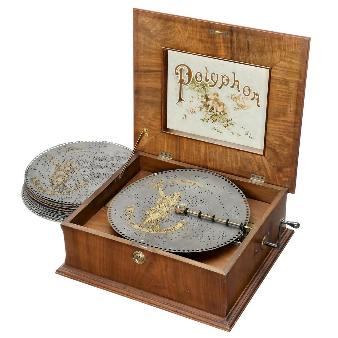 Polyphon Disc Musical Box, c. 1900: Polyphon Disc Musical Box, c. 1900 No. 9269, for discs of 15 3/4 in. By Polyphon Musikwerke, Leipzig. 77 teeth in comb (complete), walnut case with attractive original lithograph in lid. With 14 discs