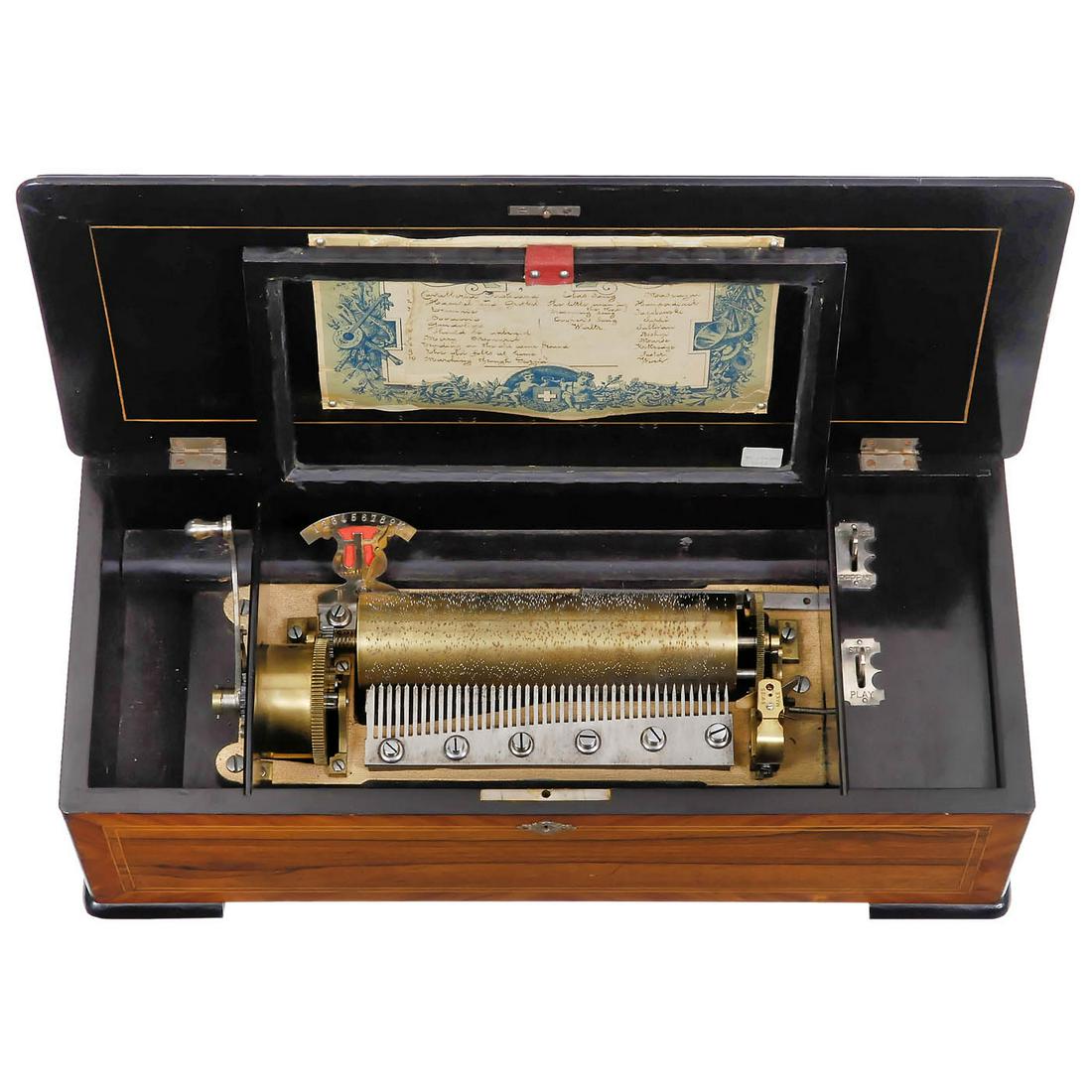 Swiss Cylinder Musical Box, c. 1885: Swiss Cylinder Musical Box, c. 1885 Gamme No. 879, playing ten popular airs, with 42 teeth in comb (complete, at least one tip neatly replaced), tune-indicator and tune-sheet, in veneered case with ba