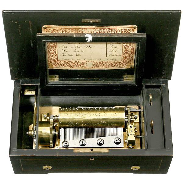 Swiss Cylinder Musical Box, c. 1885: Swiss Cylinder Musical Box, c. 1885 Unmarked, lever-wind mechanism, steel comb with 62 teeth, complete! Brass cylinder for 4 tunes, original tune sheet, wooden case with inlays, size: 12 1/2 x 7 x 4 3