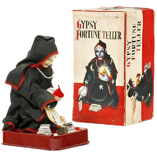 "Gypsy Fortune Teller", c. 1950: "Gypsy Fortune Teller", c. 1950 Japan Sonsco's "Gypsy Fortune Teller" produced by Ichida, Japan. With original box. With 18 of the original 20 fortune teller cards. Approx. 12 in. tall. The toy has 5 