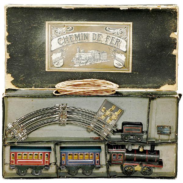 French Toy Railroad (Gauge 0): French Toy Railroad (Gauge 0) Basic set "Chemin de Fer", with steam locomotive, 2 wagons and rails, train made of lithographed tin, electric drive. Deutsche Beschreibung: Französische Spielzeugeisenb