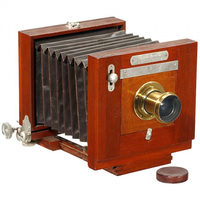 New Model Improved, c. 1895 : New Model Improved, c. 1895 Rochester Optical Co., USA. Plate size 3 1/4 x 4 3/4 in., landscape lens Rapid Universal 4 x 5 Bausch & Lomb, for waterhouse stops, camera with rack-and-pinion drive, brown