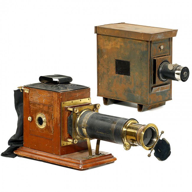 2 Large Projectors: 2 Large Projectors 1) German projector "Atom" by "Ica" Dresden, 14,8 in. high, for approx. 4,4 in. slides, electrified, cogwheel not in function, body very rusty. - 2) Unknown wooden projector with lo