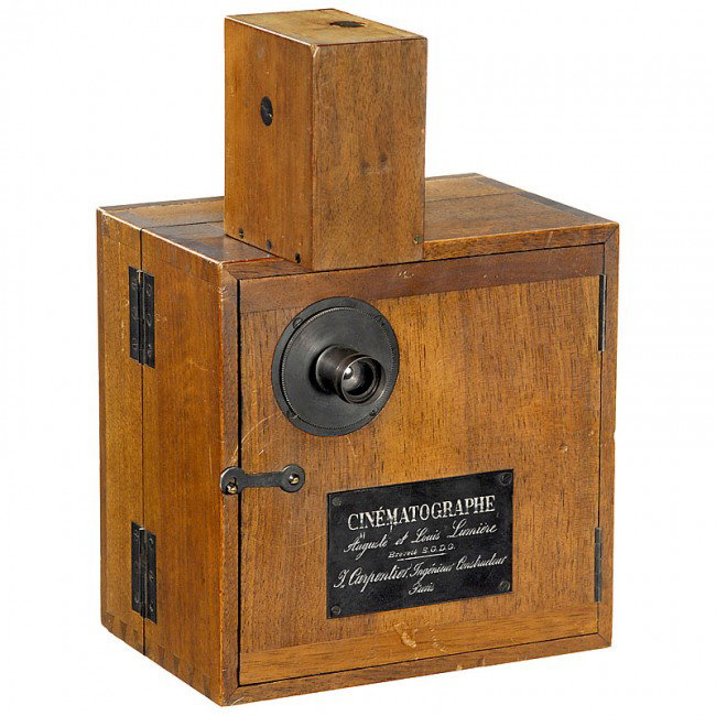 Sensational Milestone: "Cinématographe Lumière", f: Sensational Milestone: "Cinématographe Lumière", from 1895 Carpentier, Paris. Early 35mm movie camera for film with Edison perforation, handcrank-operated, mechanism mounted on brass plate, signed: 