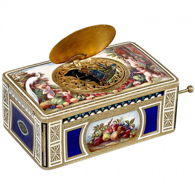 Enameled German Bird Box, c. 1935: Enameled German Bird Box, c. 1935 Manufactured by Karl Griesbaum - Black Forest, Germany. Spring-driven. The bird sings and turns around, flaps his wings and opens and closes his beak. - Bellows need