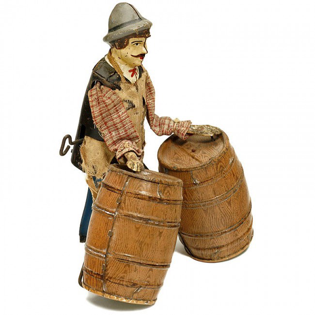 "Barrel Roller" by Martin (No. 207), 1907: "Barrel Roller" by Martin (No. 207), 1907 Early French tin toy, clockwork-driven (defective). Unrestored original condition with faded paint, clothes incomplete, 7 1/2 in. high, very rare! - Literatur