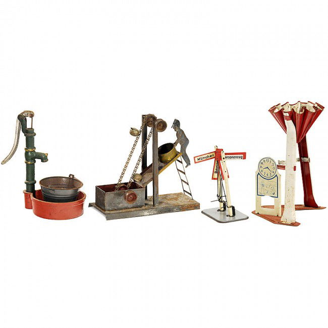 2 Mechanical Water Toys: 2 Mechanical Water Toys 1) Dredge, steam toy, hand-painted tin. - And: Hand-pump, cast metal, with tin bucket. - Add-on: Railway direction indicator, gauge 0, and one incomplete sand toy. 2 mechanisch