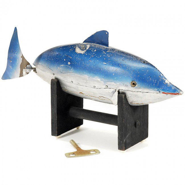 Mechanical "Dolphin", c. 1930: Mechanical "Dolphin", c. 1930 American water toy, manufacturer unknown, clockwork for the motion of the tail (working), with wooden bottom, tin-made tail and upper part. - Very unusual rare collector'