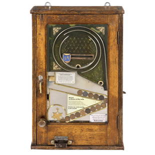 German "HenkeltÃ¶pfchen" Amusement Machine, c. 1930: German "HenkeltÃ¶pfchen" Amusement Machine, c. 1930 Wilhelm FÃ¼rst, Apparate-Bauanstalt, Berlin. Mechanical skill game with payout, a slingshot and catcher combination, oak case, with lock and key