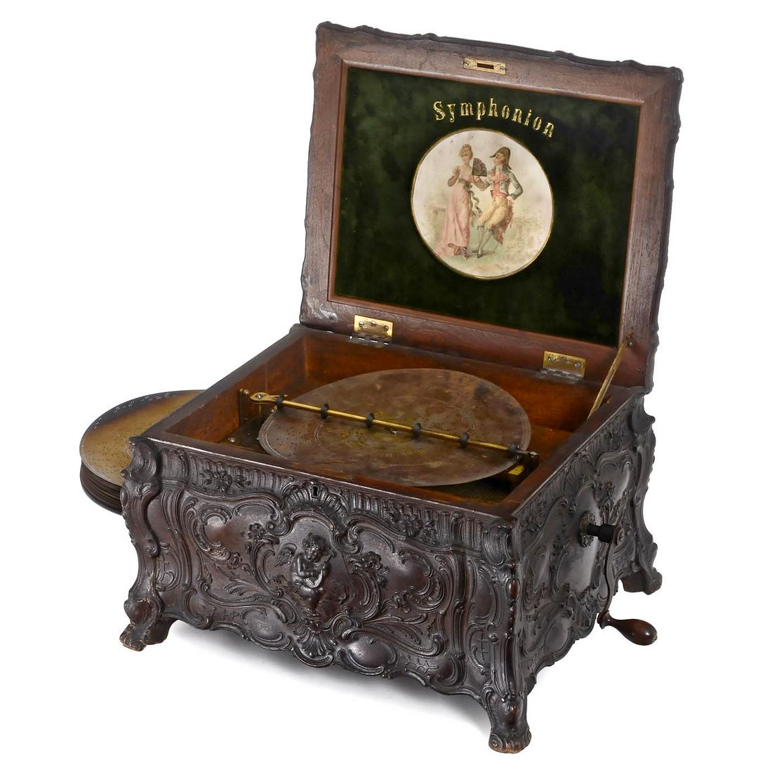 Rococo Nr. 25C Symphonion 11 Â¾-inch Disc Musical Box, c. 1895: Rococo Nr. 25C Symphonion 11 ¾-inch Disc Musical Box, c. 1895 Symphonion Musikwerke, Leipzig. No. 327615 with duplex comb of 84 teeth (complete), in pressed walnut bombÃ© case decorated with 