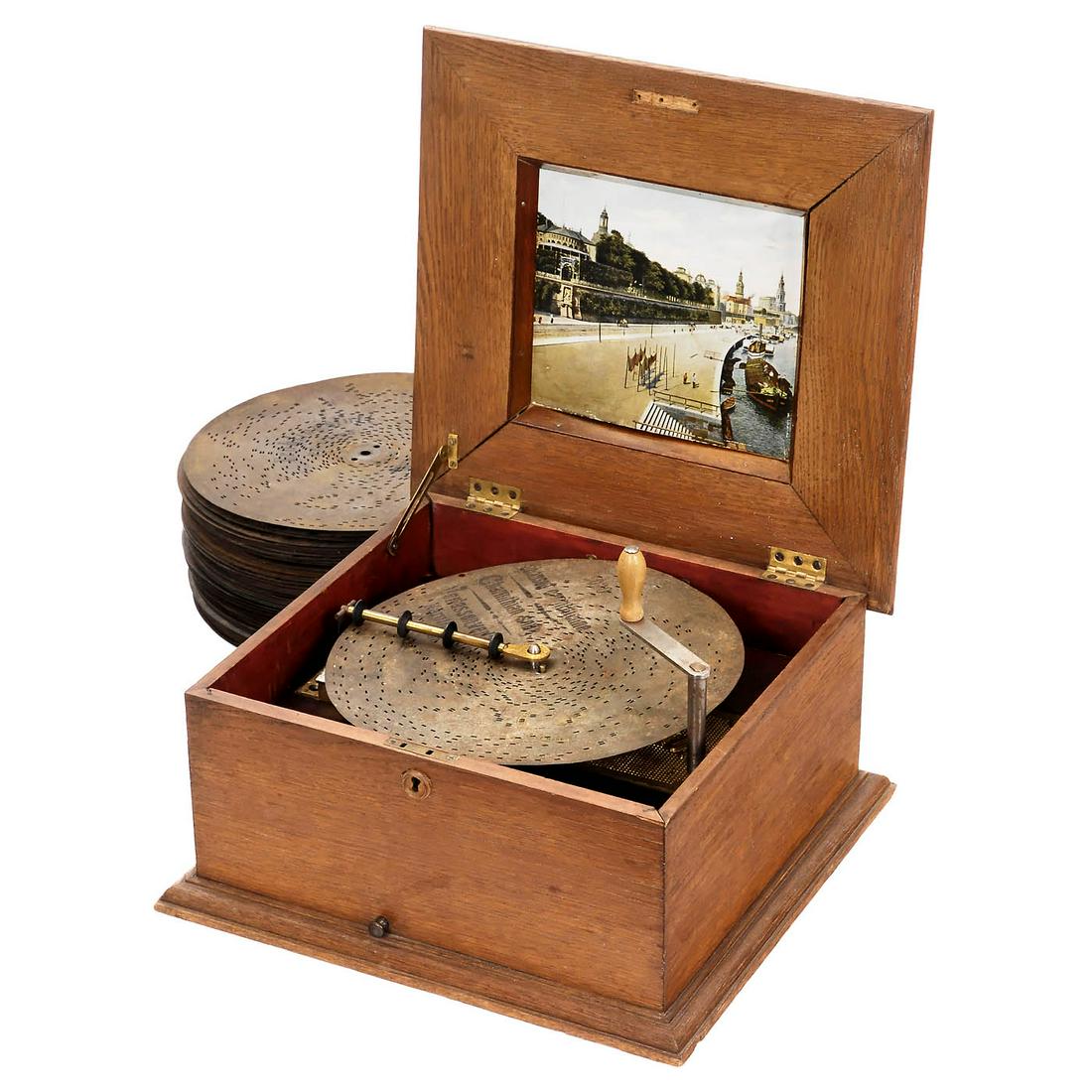 Polyphon No. 42 Disc Musical Box with 53 Discs, c. 1900: Polyphon No. 42 Disc Musical Box with 53 Discs, c. 1900 Polyphon Musikwerke Leipzig. For 11 ¼ in. discs, 54 teeth in comb (complete), playing condition, mechanism in need of re-fixing in case. 