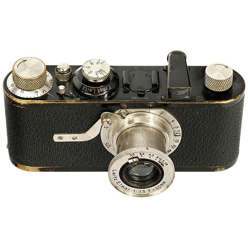 Leica I (A), 1928: Leica I (A), 1928 Leitz, Wetzlar. Early 4-digit serial number 7282. Threaded release button and tall wind knob, Elmar 3,5/50 mm. With lens cap. Leica I (A), 1928 Leitz, Wetzlar. Frühe 4-stellige Seri