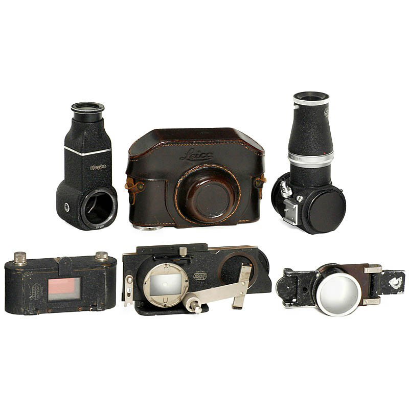 Leica Accessories: Leica Accessories 1) Leitz, Wetzlar. Visoflex I for Leica M with vertical magnifier LVFOO. - 2) Focoslide OOAZB, early version with single plate arm. - 3) Printing device ELDIA. - 4) Special leather c