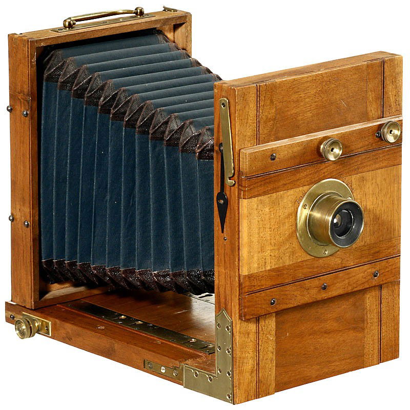 German Tailboard Camera, c. 1870: German Tailboard Camera, c. 1870 Unmarked, format 13 x 18 cm, precious wood body with brass fittings, unmarked brass lens with rotating diaphragm, conical green bellows with black leather corners, gr