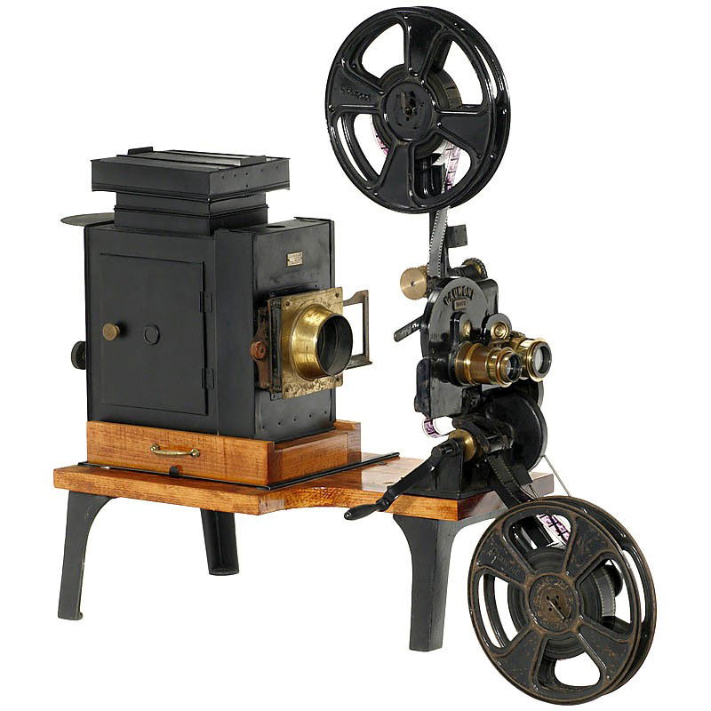 Double Projector Gaumont, c. 1914: Double Projector Gaumont, c. 1914 Manufactured by "Gaumont & Cie, Paris", table projector for 35mm film and 8,5 x 10,5 cm glass slides, projection head with 2 brass lenses (Cindo and Hermagis, Paris)